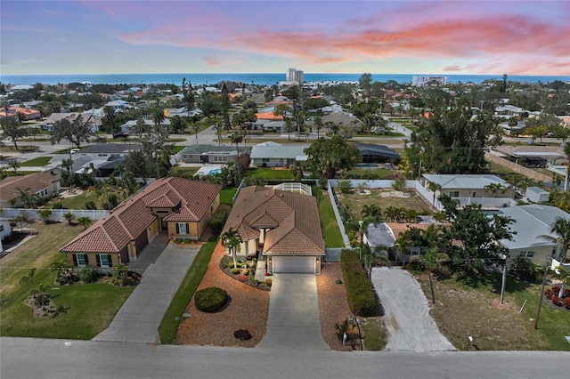 aerial view featuring a water view and a residential view