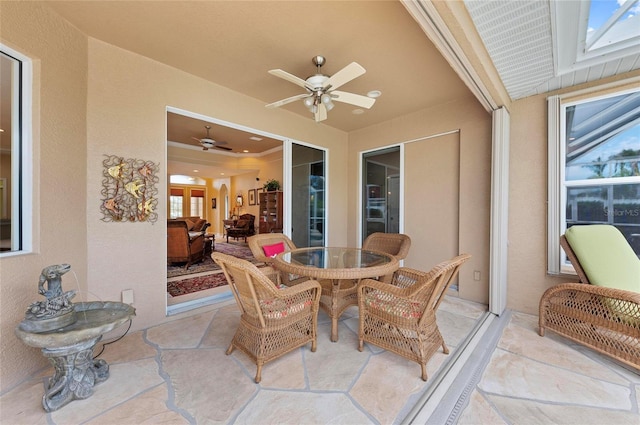 view of patio / terrace with outdoor dining space and a ceiling fan