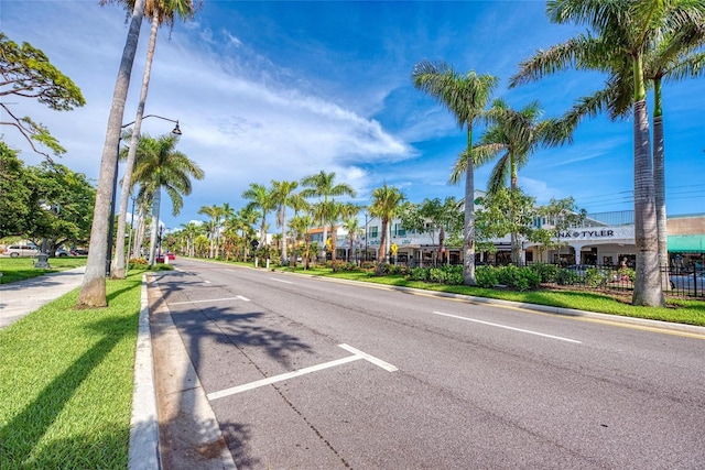 view of road with curbs and sidewalks