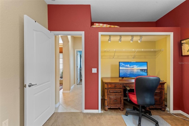 carpeted home office featuring tile patterned flooring and baseboards