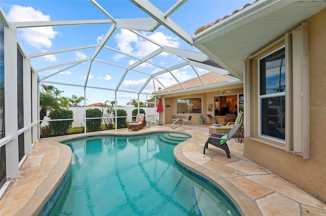 pool featuring a patio and glass enclosure