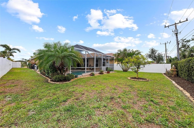 view of yard featuring a lanai, a fenced backyard, and a fenced in pool