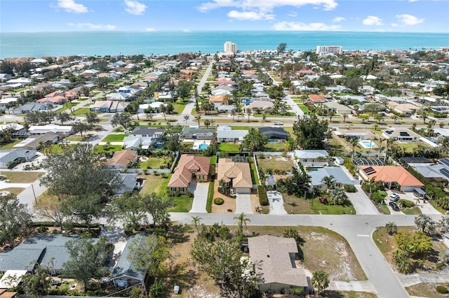 bird's eye view featuring a water view and a residential view