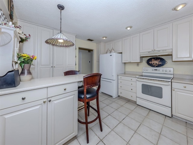 kitchen featuring white appliances, light tile patterned floors, light countertops, white cabinets, and under cabinet range hood