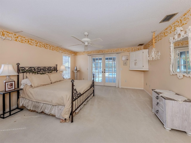 bedroom featuring visible vents, baseboards, light colored carpet, french doors, and access to outside