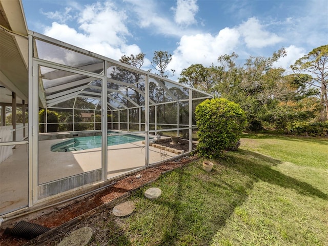 outdoor pool with a lanai, a yard, and a patio