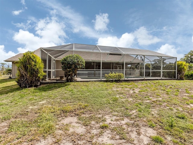 exterior space with a lawn and a lanai