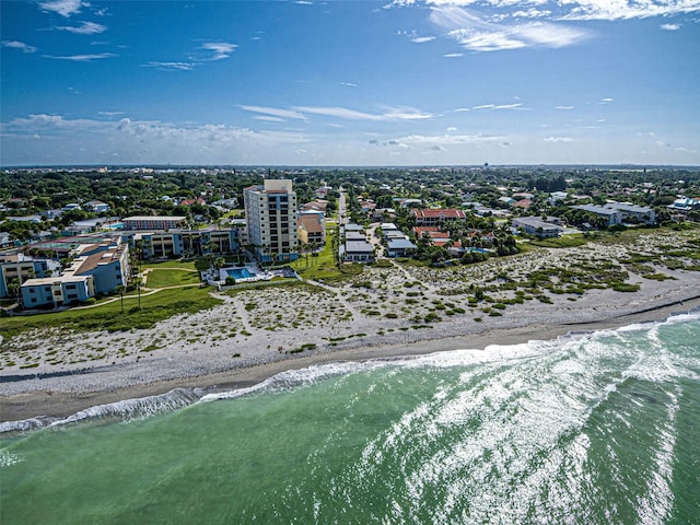 drone / aerial view featuring a water view and a beach view