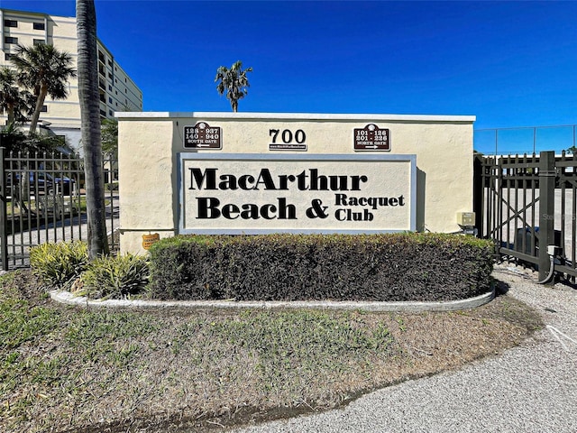 community sign with fence