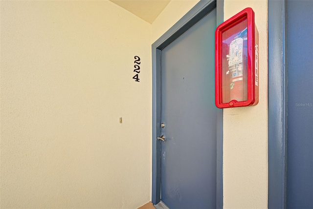 view of exterior entry featuring stucco siding