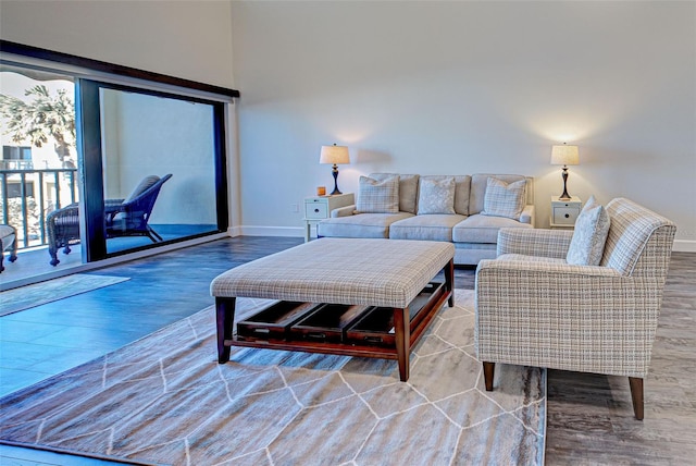 living room featuring wood finished floors and baseboards