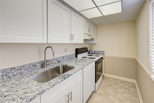 kitchen featuring light stone counters, electric stove, white dishwasher, a sink, and under cabinet range hood