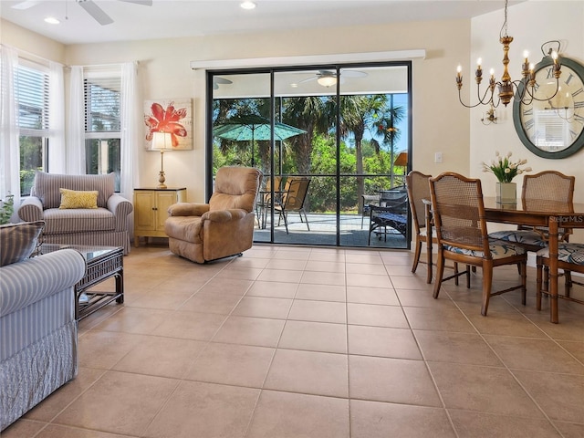 interior space featuring ceiling fan with notable chandelier and recessed lighting