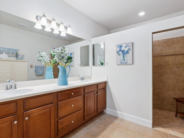 full bath with tile patterned flooring, a sink, a tile shower, and double vanity