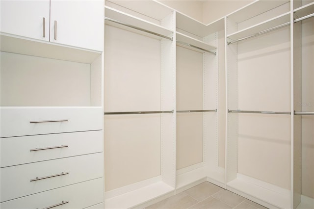 spacious closet with light tile patterned flooring