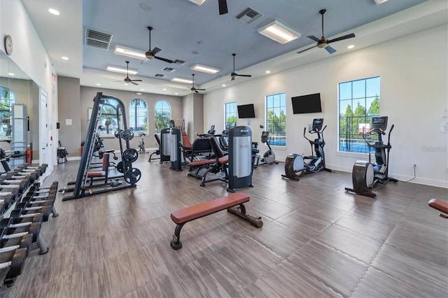 exercise room featuring recessed lighting, visible vents, and baseboards