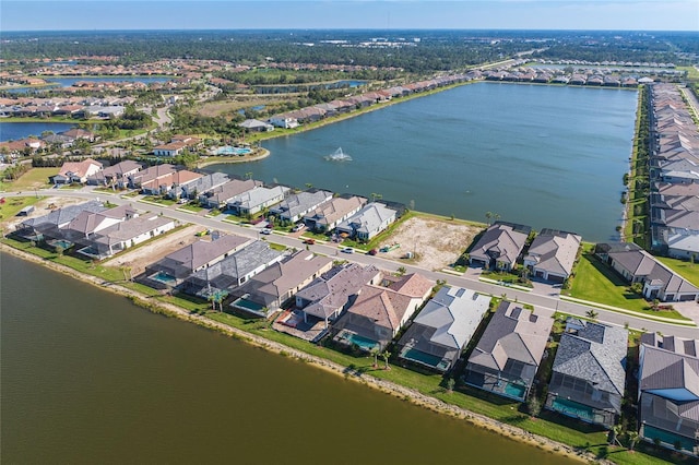 bird's eye view with a water view and a residential view