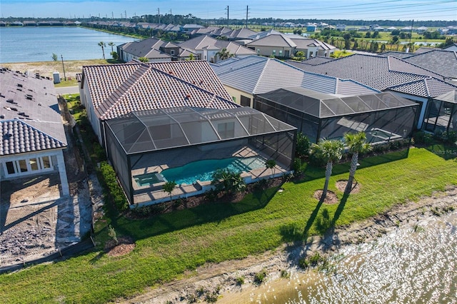 aerial view featuring a water view and a residential view