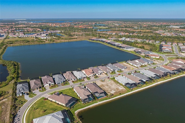 bird's eye view with a residential view and a water view