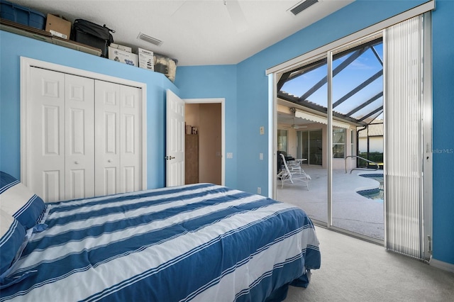 bedroom featuring carpet floors, access to outside, visible vents, and a closet