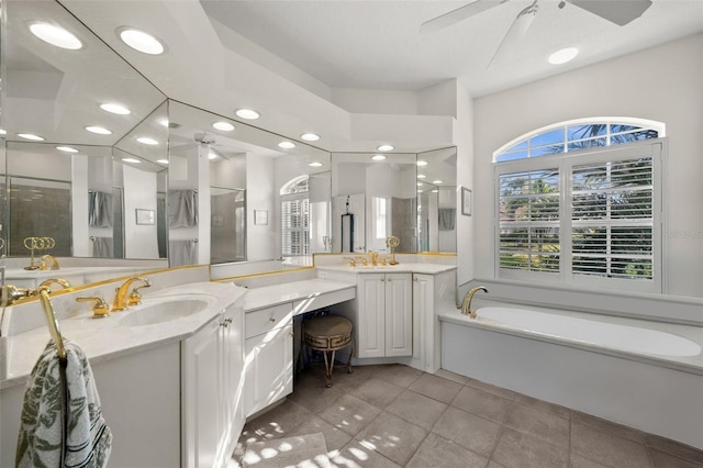 full bathroom with a stall shower, ceiling fan, tile patterned floors, vanity, and a bath