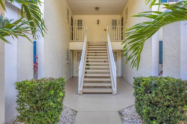 property entrance with stucco siding