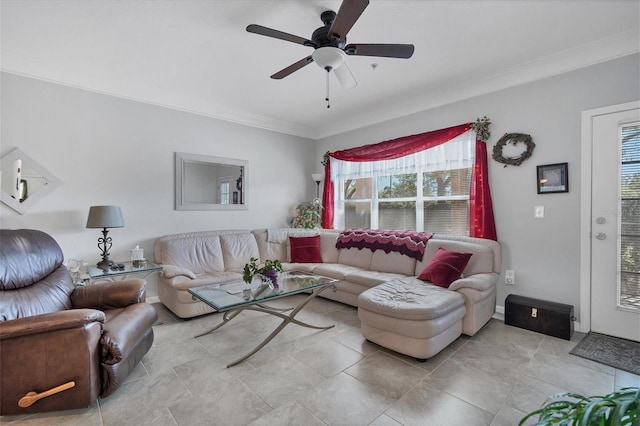 living room featuring a ceiling fan and crown molding