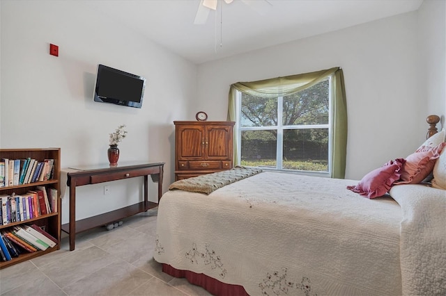 bedroom featuring ceiling fan and light tile patterned flooring