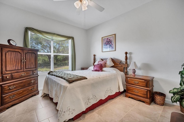 bedroom featuring light tile patterned floors and ceiling fan