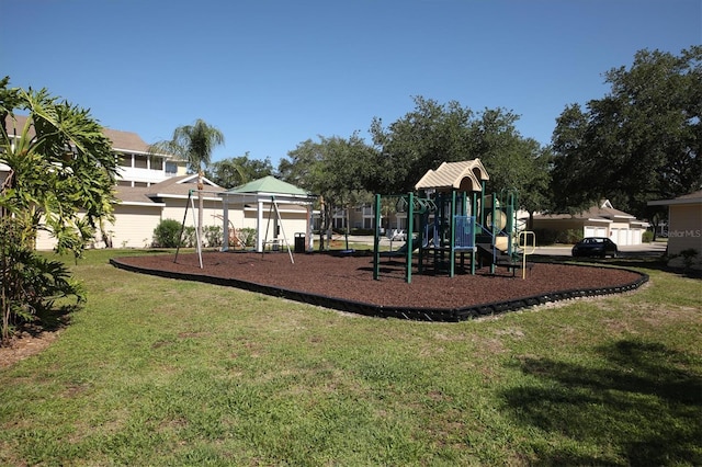 communal playground featuring a lawn