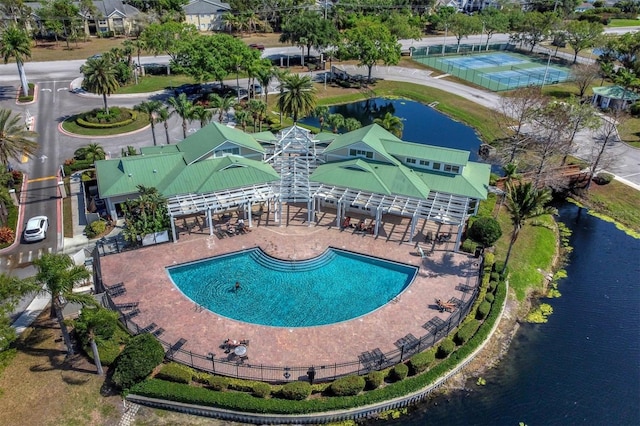 view of pool with a water view