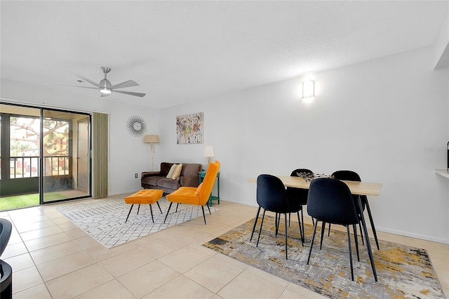 tiled dining room with ceiling fan