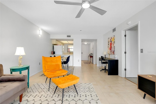 living room with light tile patterned floors, ceiling fan, and visible vents