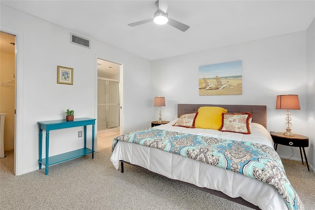 bedroom with visible vents, baseboards, connected bathroom, ceiling fan, and carpet