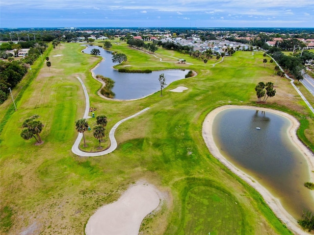 drone / aerial view featuring a water view and golf course view