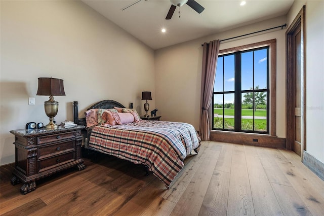 bedroom featuring a ceiling fan, hardwood / wood-style flooring, and recessed lighting