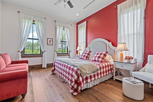 bedroom featuring ceiling fan, hardwood / wood-style floors, and recessed lighting