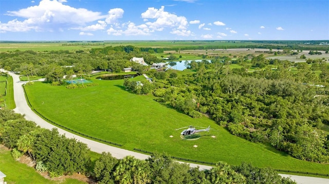 birds eye view of property with a rural view and a water view