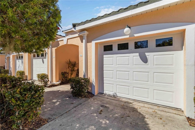 exterior space featuring concrete driveway