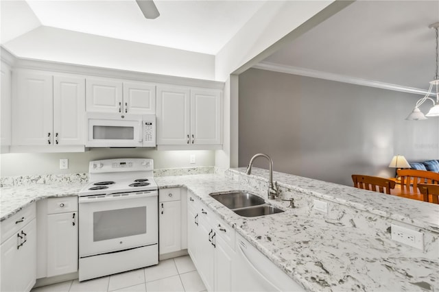 kitchen with white appliances, light tile patterned floors, ornamental molding, a sink, and white cabinets