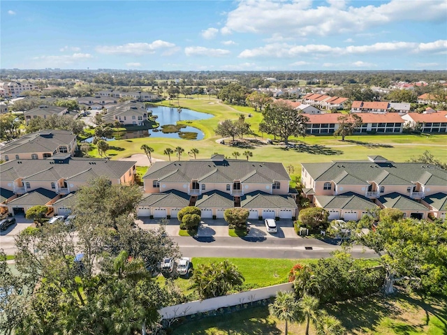 aerial view featuring view of golf course, a residential view, and a water view