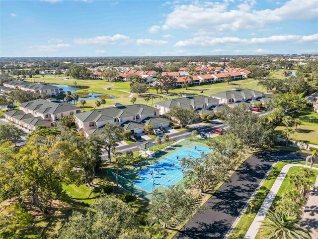 drone / aerial view with a residential view and a water view