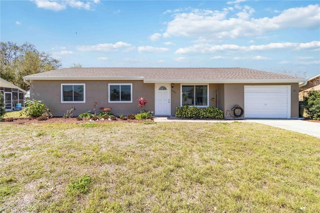 single story home with a front lawn, concrete driveway, a garage, and stucco siding