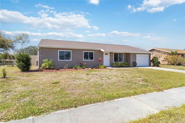 single story home with fence, concrete driveway, a front yard, stucco siding, and an attached garage