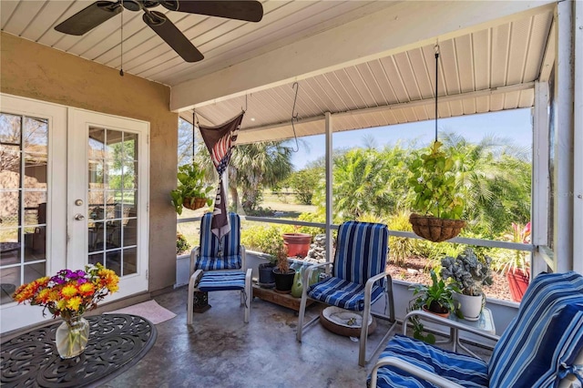 sunroom featuring french doors and ceiling fan