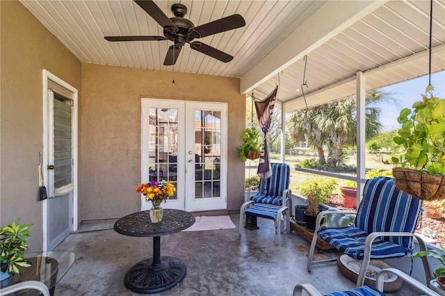 sunroom / solarium with french doors, wooden ceiling, and a ceiling fan