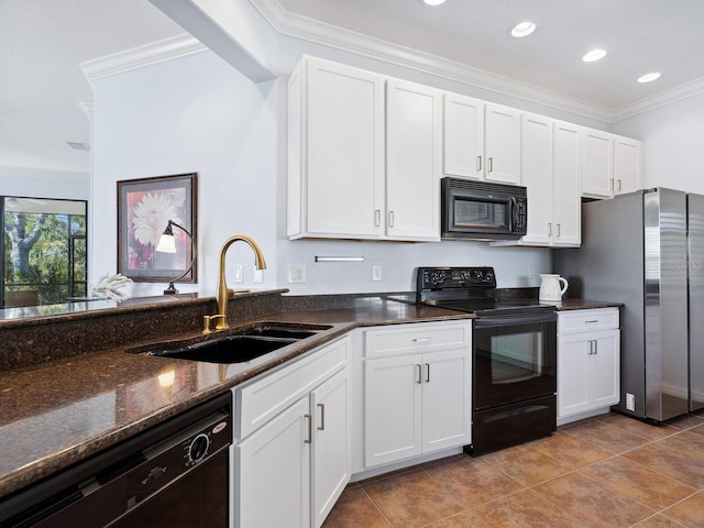 kitchen featuring white cabinets, dark stone counters, ornamental molding, black appliances, and a sink