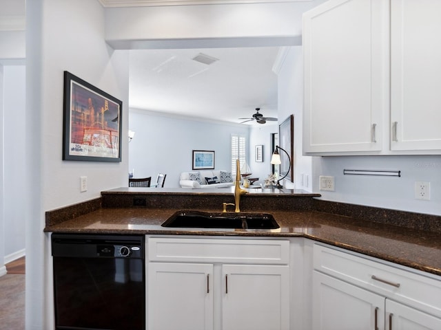 kitchen with black dishwasher, white cabinets, a sink, and dark stone countertops