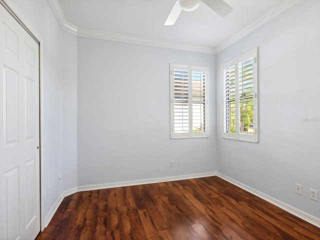 unfurnished room featuring baseboards, ornamental molding, and wood finished floors