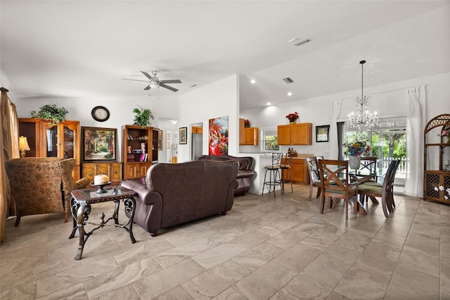 living room with ceiling fan with notable chandelier and visible vents